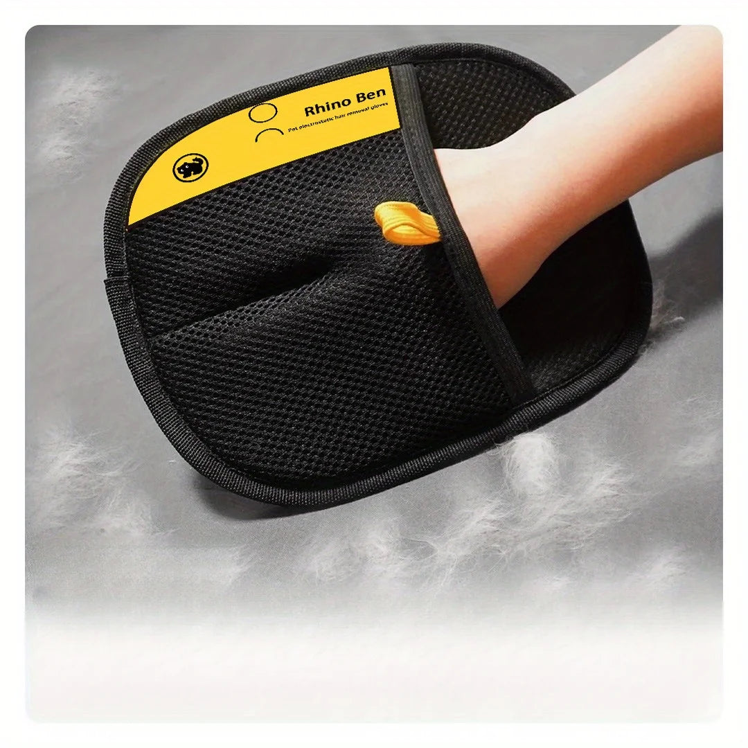 A hand wears a black, mesh-textured pet hair removal glove with a yellow Rhino Ben brand label.