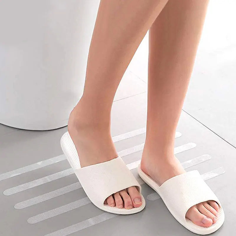 Showlu Smart General anti-slip shower stickers on a bathroom floor for added safety and grip.