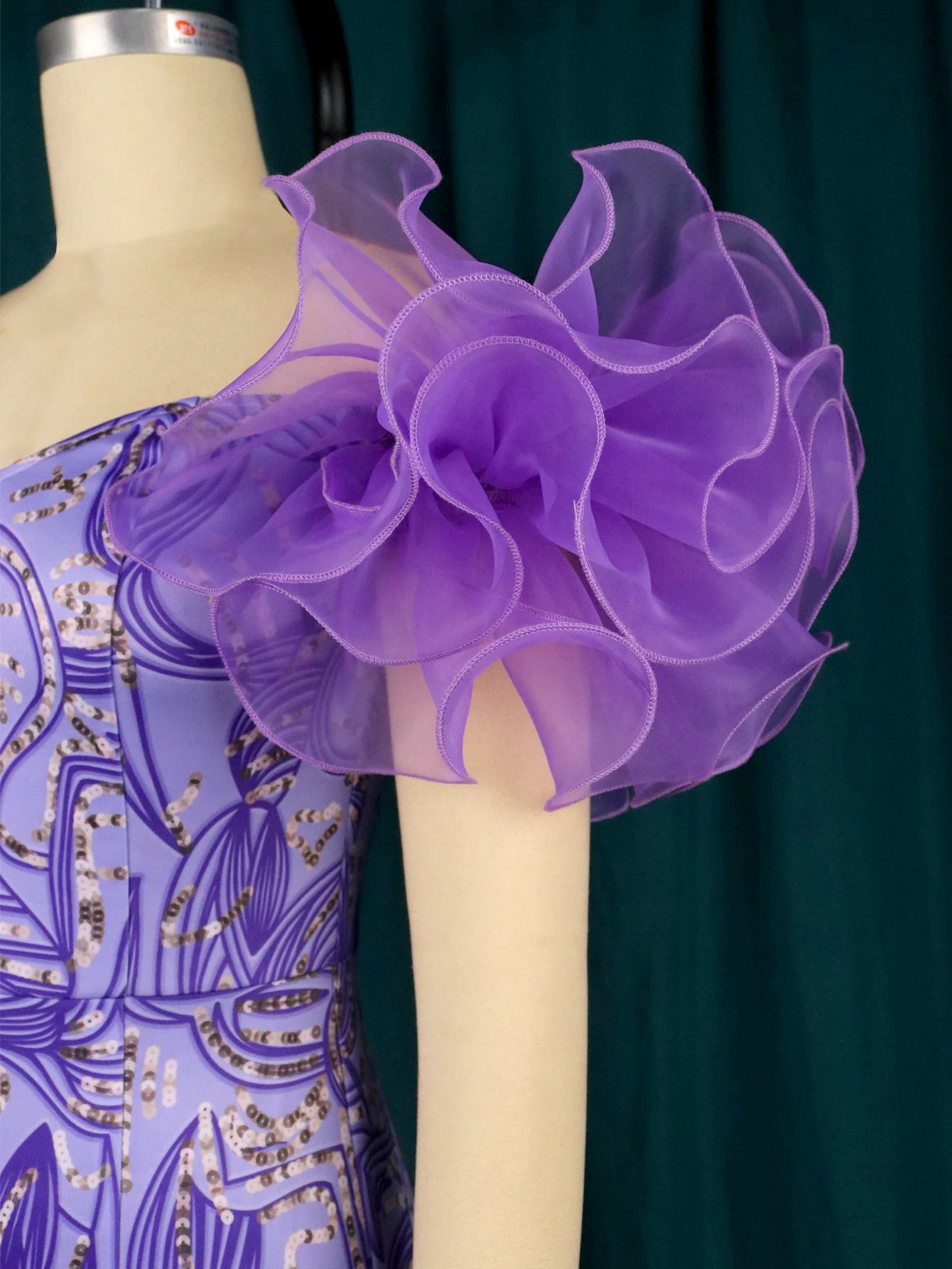 Woman wearing a Showlu Fashion Store floral print off-shoulder tulle midi dress with leaf accents, suitable for African events and weddings