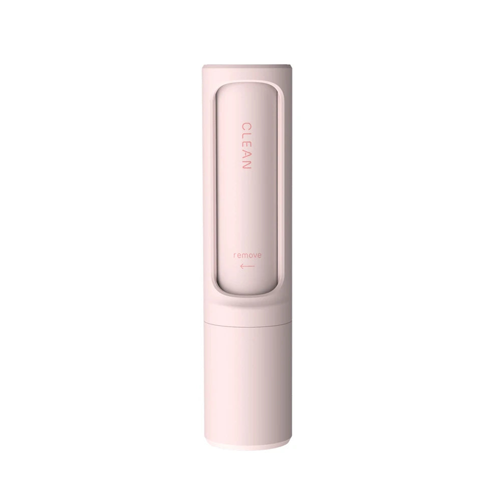 Showlu Smart General reusable pet hair remover lint roller with replaceable sheets on a surface, designed for removing pet fur and lint.