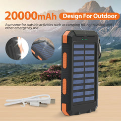 A black and orange portable solar power bank with a charging cable on a wooden surface.