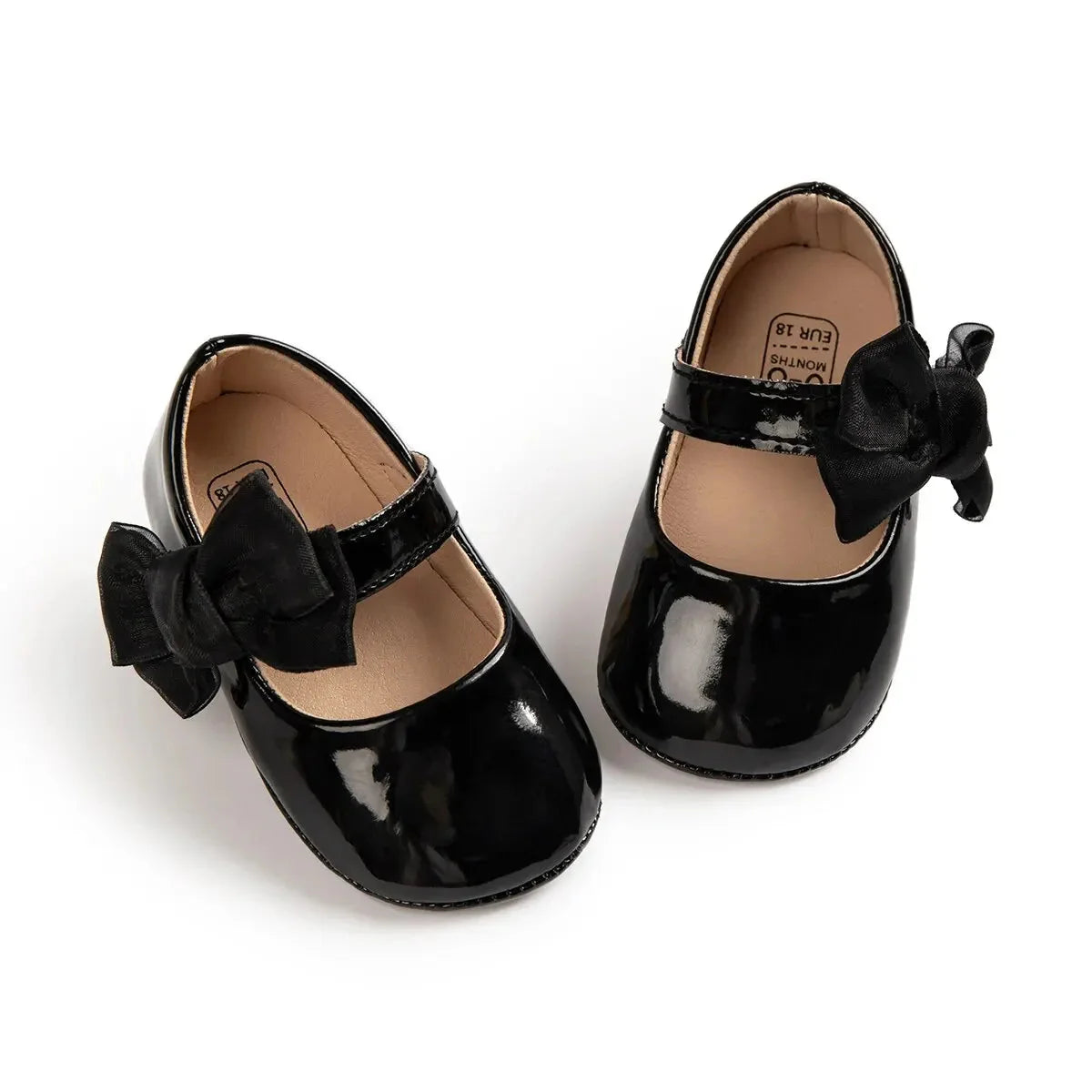 Baby girls' PU leather bowknot shoes by Meckior with non-slip soles, perfect for first steps and stylish comfort.