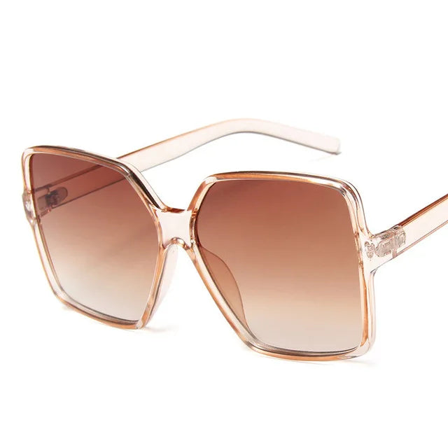 Fashion women's oversized sunglasses from Showlu with gradient plastic lenses, UV400 protection, stylish designer sun glasses.