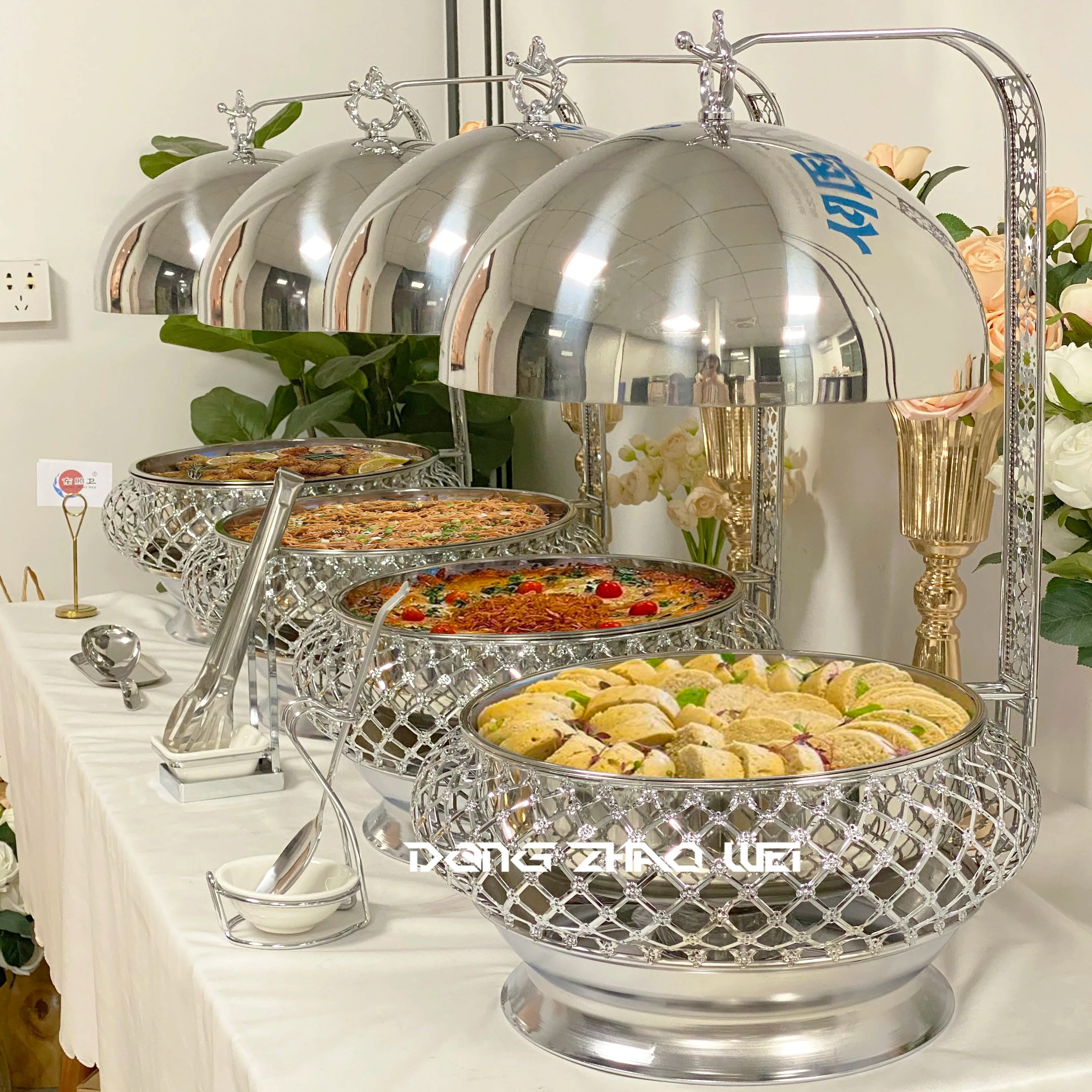 Stainless steel wedding party chafing dish with hanging design, used for buffet food warming at catering events.