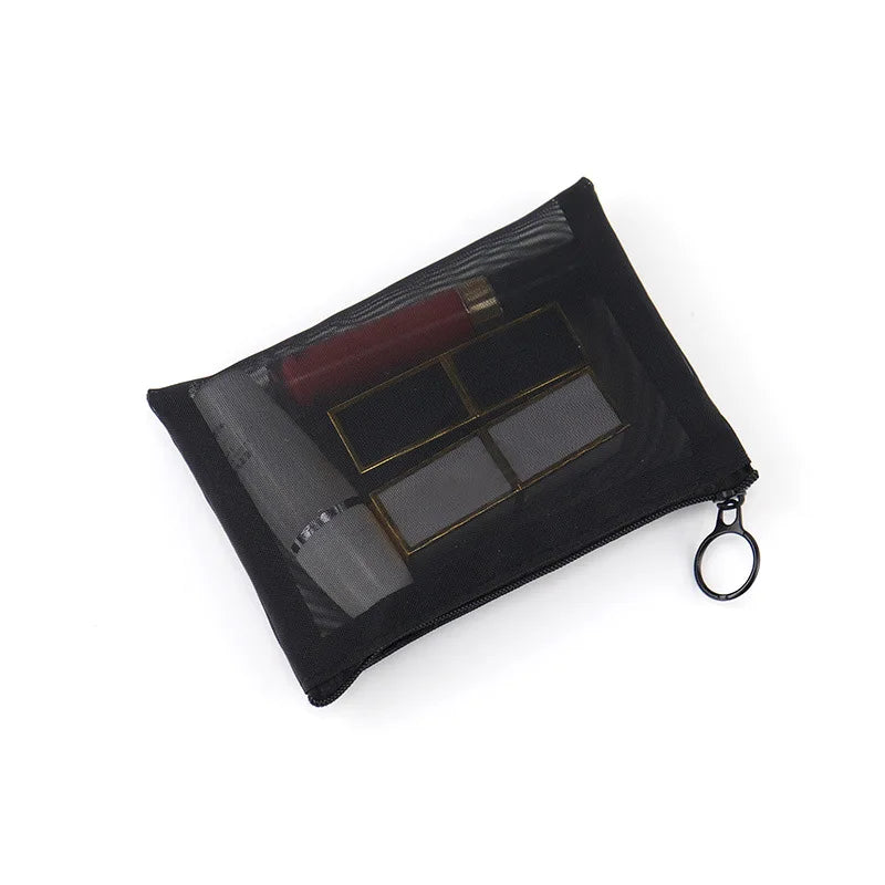 Large black transparent mesh travel makeup bag with multiple compartments for storage and organization during outdoor trips