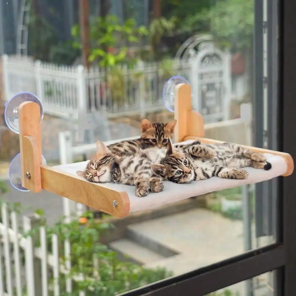 Showlu Wooden Cat Window Perch with cozy faux fur hammock and suction cups for secure attachment to window surface.