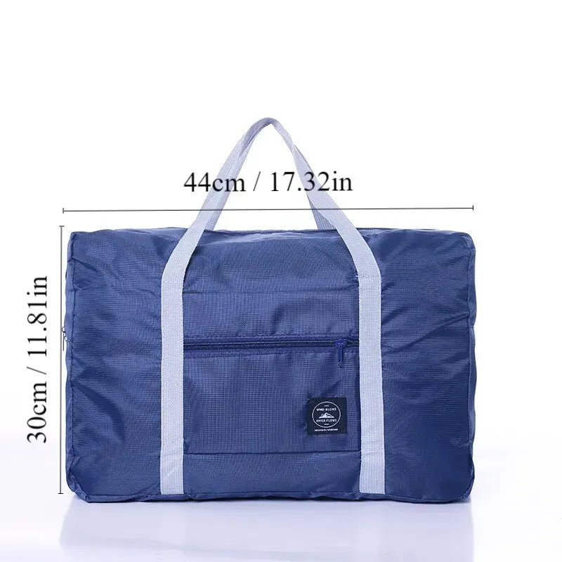 Red, navy, and green multifunctional folding travel bag with large capacity, waterproof design, single shoulder strap, for luggage storage.