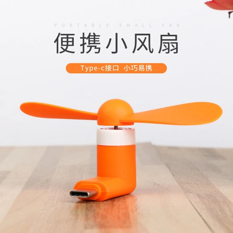 Showlu Smart General USB mini fan with compact design and adjustable blades, ideal for portable cooling.