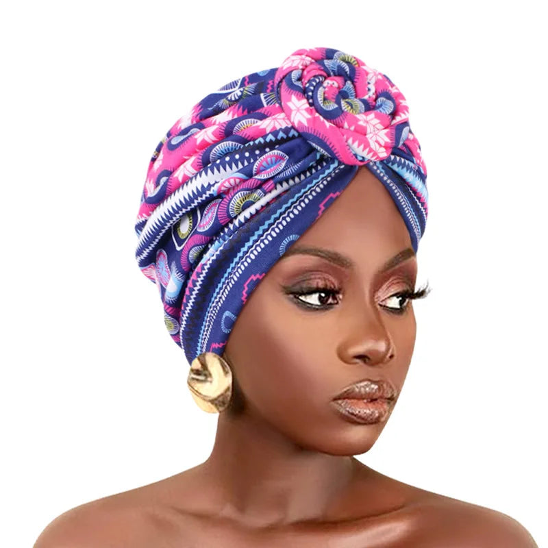 Elegant African print pleated turban with floral design, pre-tied front knot, elastic head wrap, and bandana style chemo cap for women