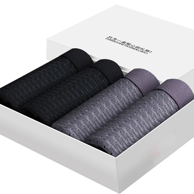 Men's ice silk boxer shorts by Showlu Fashion Store, breathable mesh underwear in a 4-pack, comfortable and lightweight for everyday wear.