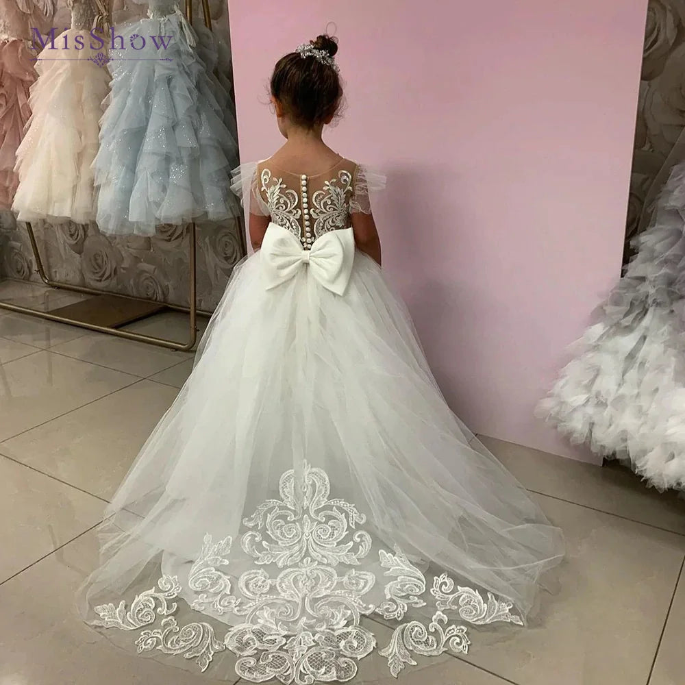 Lace tulle flower girl dress by Showlu Fashion, princess ball gown style for weddings, with delicate floral embroidery and satin sash.