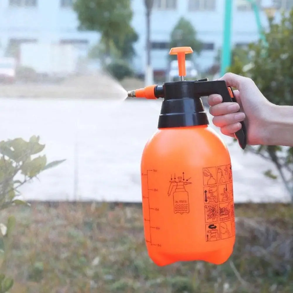 Showlu Smart General high pressure spray bottle with ergonomic handle and transparent body for gardening or cleaning tasks.