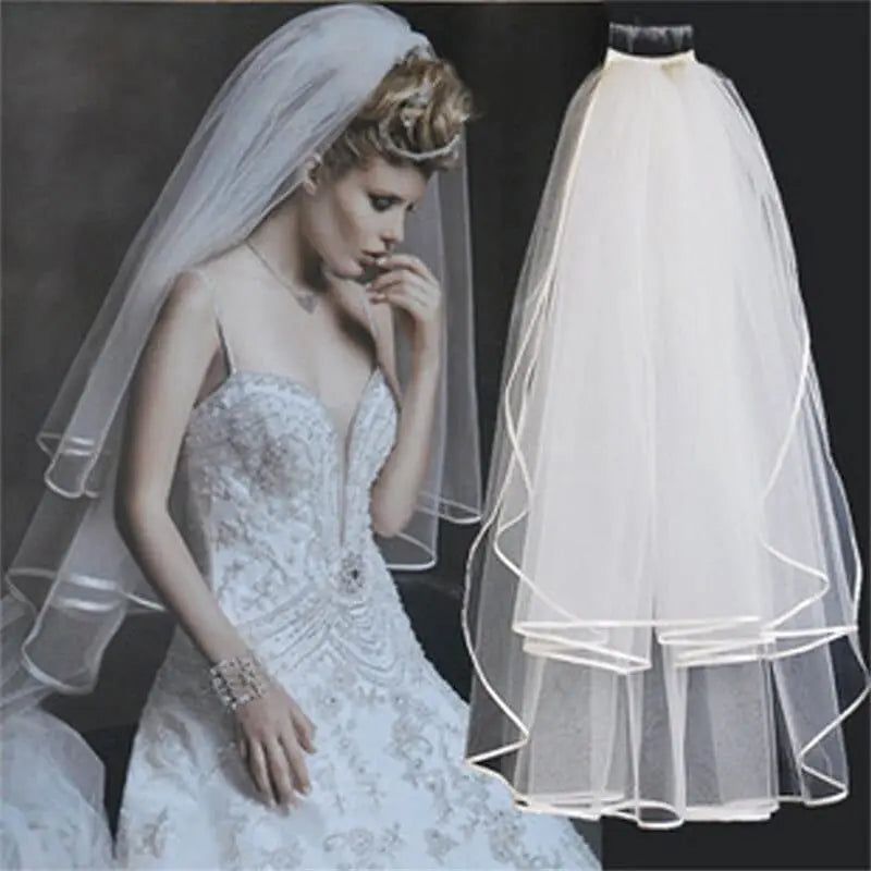 Showlu two-layer ivory tulle wedding veil with comb, shoulder length, simple and elegant bridal accessory for marriage.