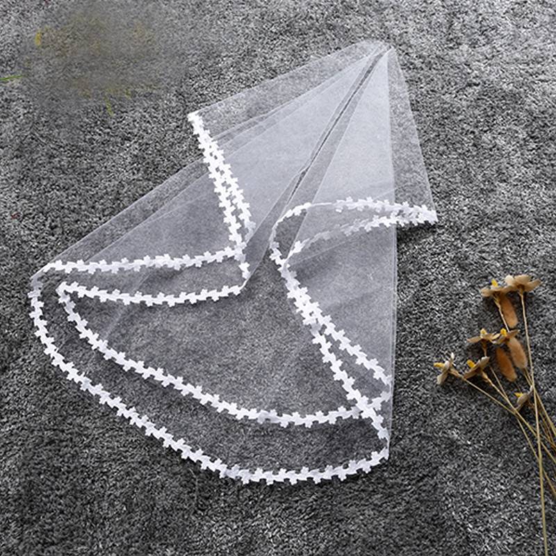Showlu two-layer shoulder-length tulle wedding veil with comb, white ivory bridal accessory for bride and marriage ceremonies.