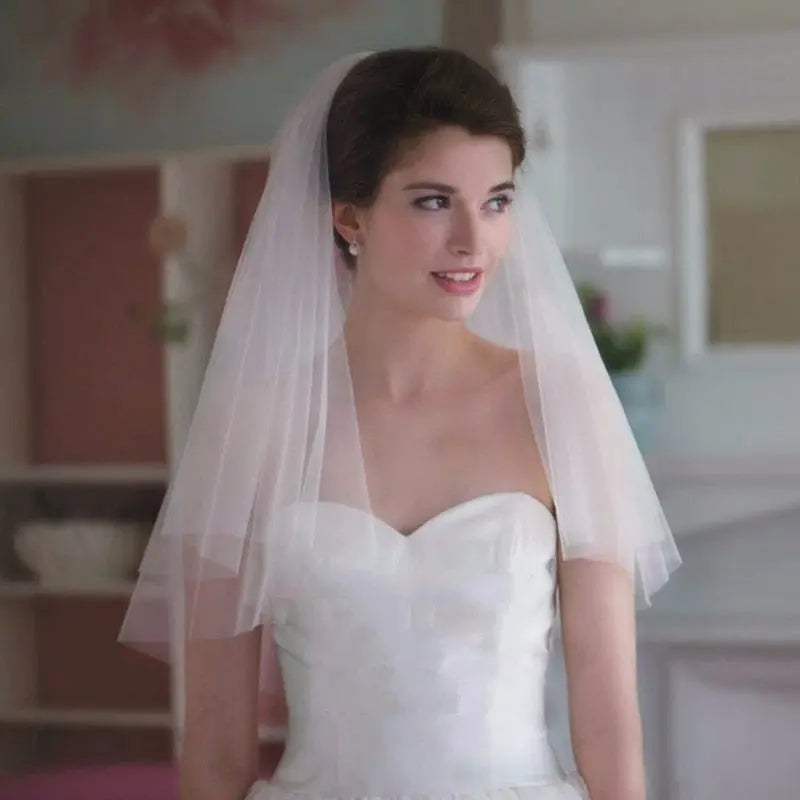Two-layer white tulle wedding veil with comb from Showlu Fashion Store, shoulder-length bridal accessory for marriage and wedding.