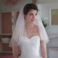 Two-layer white tulle wedding veil with comb from Showlu Fashion Store, shoulder-length bridal accessory for marriage and wedding.