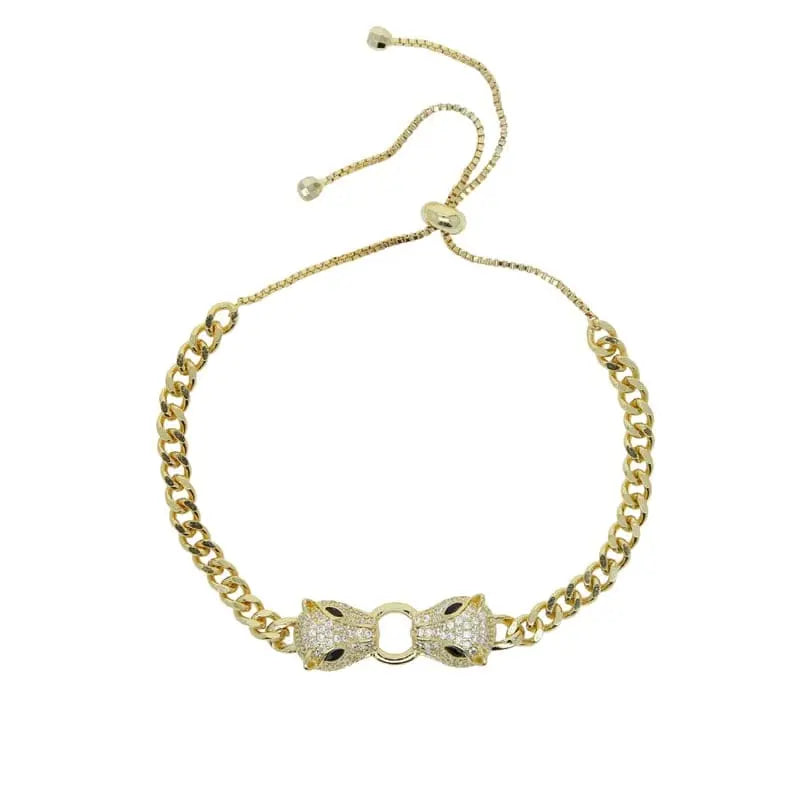 Showlu Store Nation silver and gold-colored Cuban link bracelet with double jaguar head design and CZ stones for women.