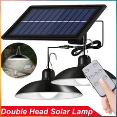 A double-head solar pendant light with a remote control and a solar panel.