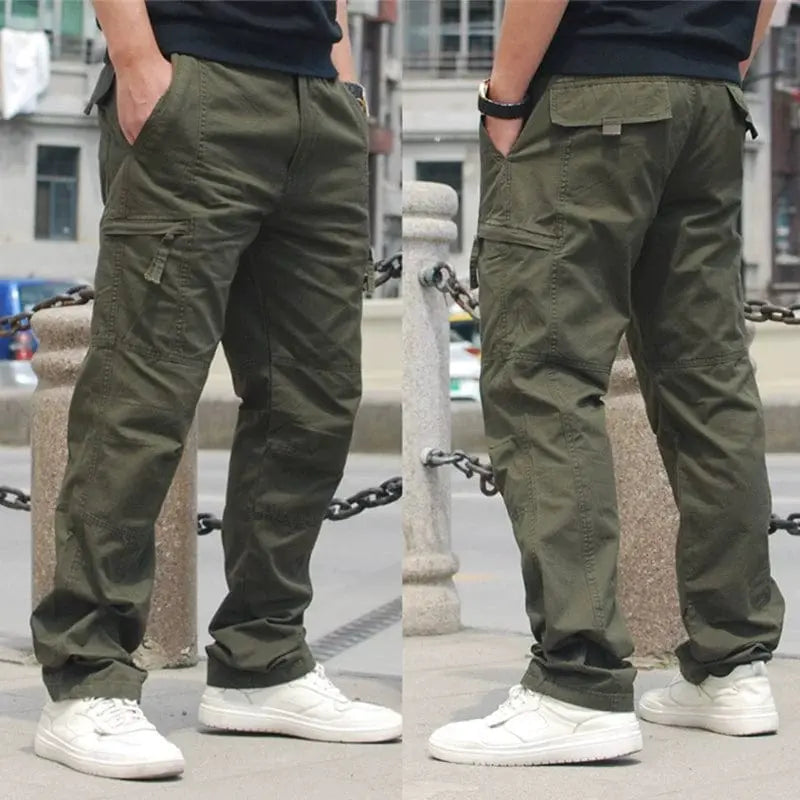 Men's casual outdoor pants by Showlu Fashion with multi-pocket design, elastic waist, made from 100% cotton for spring wear.