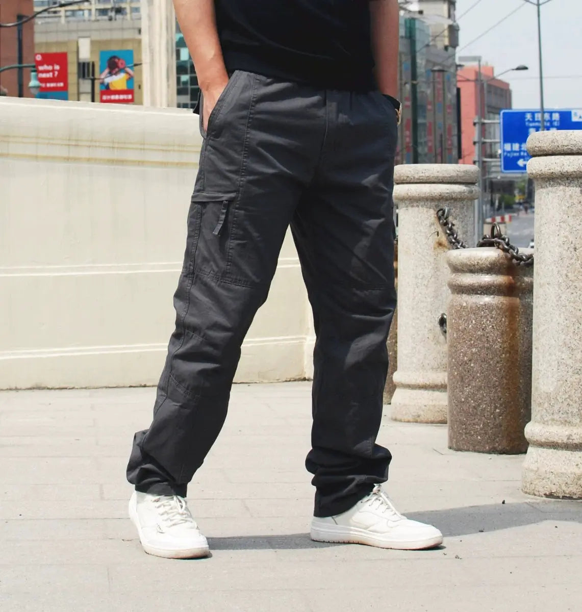 Showlu Fashion men's cotton outdoor casual pants with multiple pockets and elastic waist, suitable for spring outdoor wear.