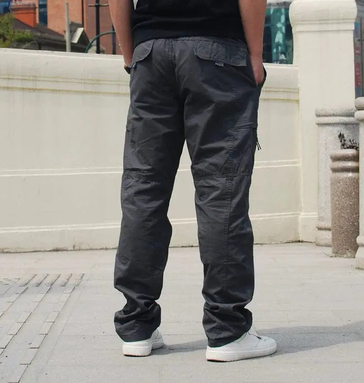Showlu Fashion men's 100% cotton casual outdoor pants with multiple pockets and elastic waist, ideal for spring outdoor wear