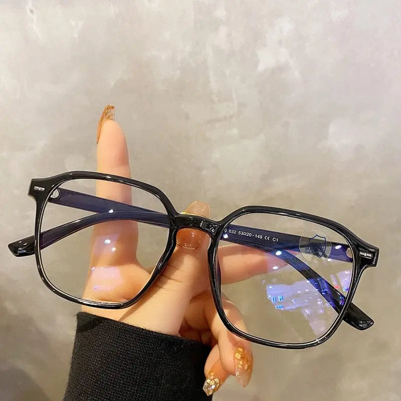 Showlu square polygon blue light blocking glasses with unisex plastic frame, featuring sleek design and blue tinted lenses.