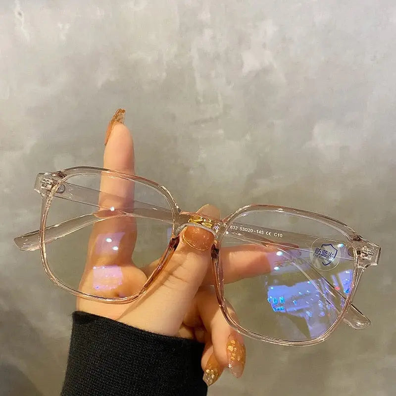 Showlu Square Polygon Blue Light Blocking Glasses with plastic frame, unisex eyewear for men and women, featuring blue tint lenses.