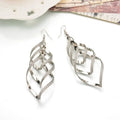 Frosted resin and metal bohemia tassel drop earrings for women, stylish and trendy jewelry accessory.