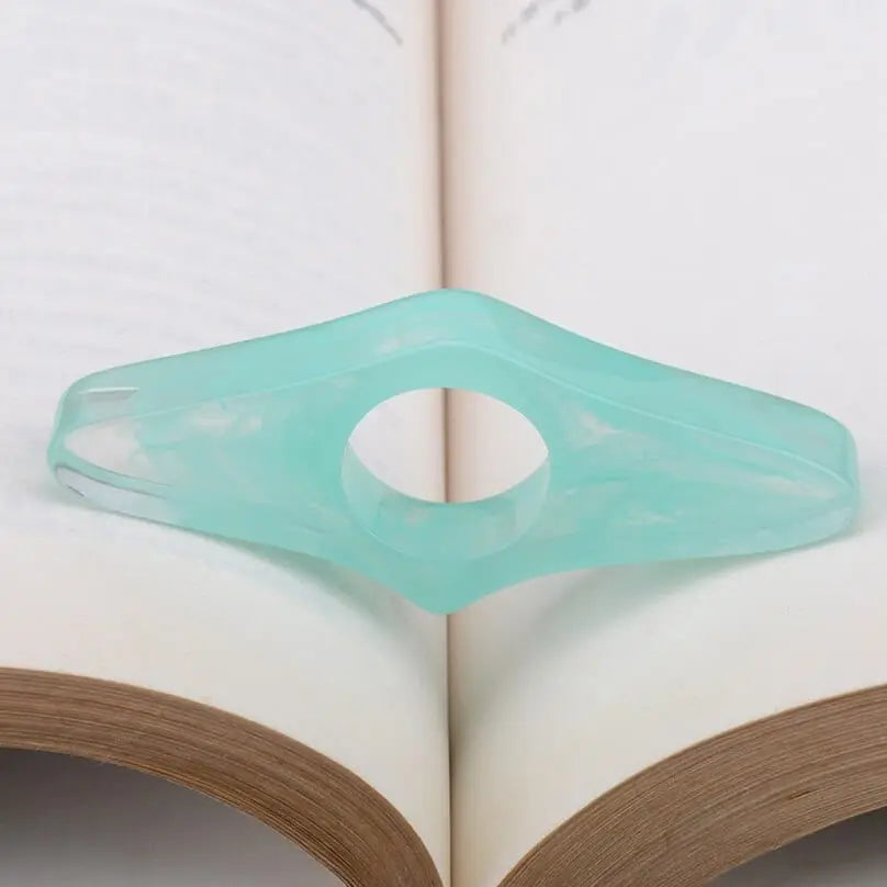 Acrylic thumb book page holder with geometric design for reading support, ideal for keeping pages open during reading or studying.