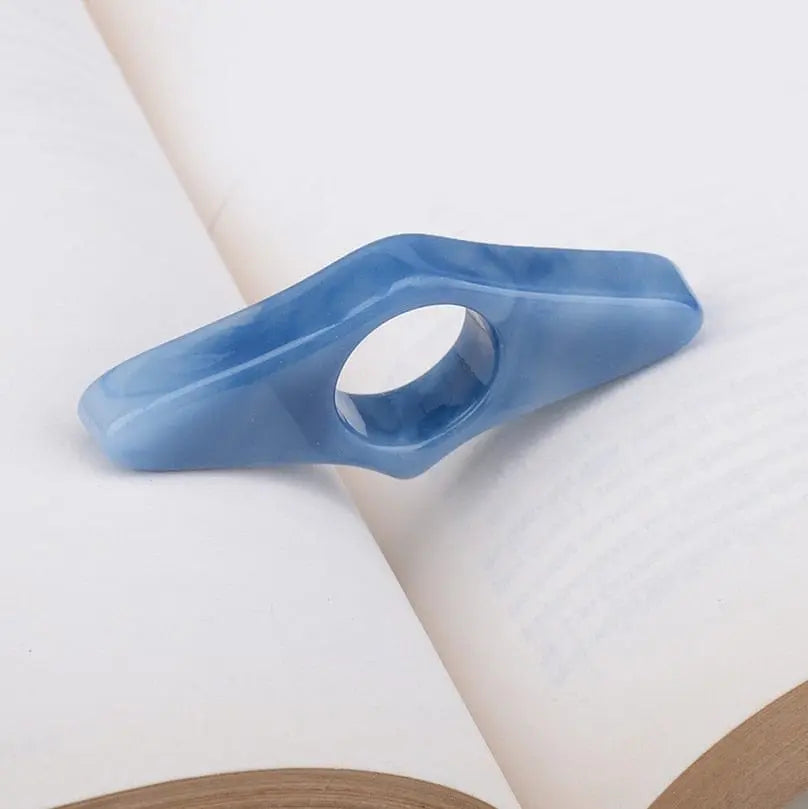 Acrylic thumb book page holder with geometric design, perfect for supporting pages while reading or studying. Showlu Fashion Store.