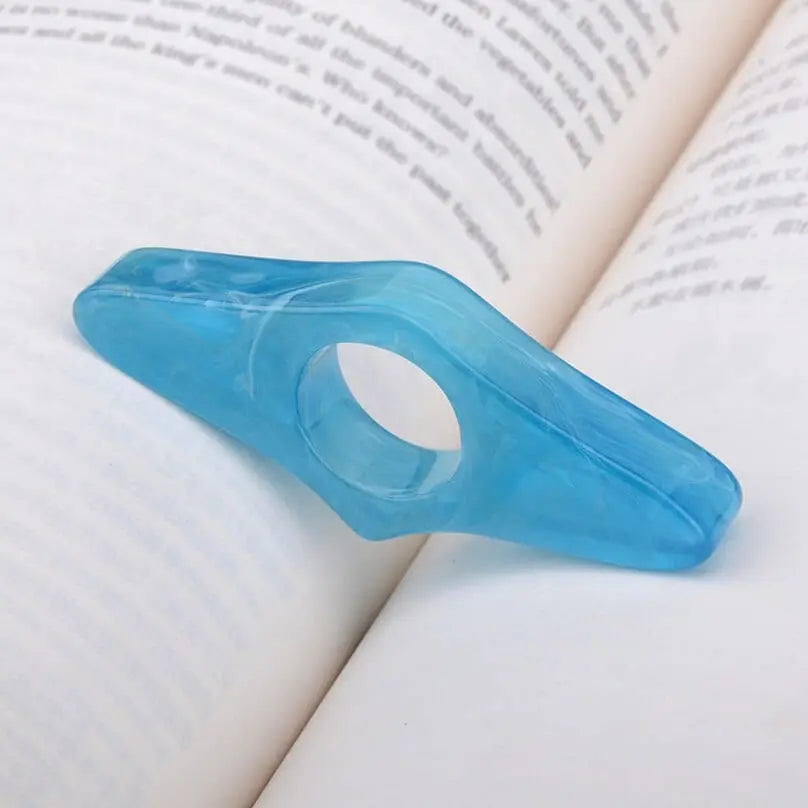 Acrylic thumb book page holder with geometric design, supporting pages during reading, by Showlu Fashion Store.