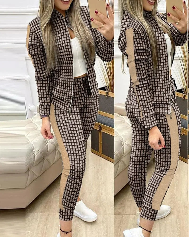 Women’s leopard print two-piece tracksuit with zipper top and matching leggings by Showlu Fashion Store.