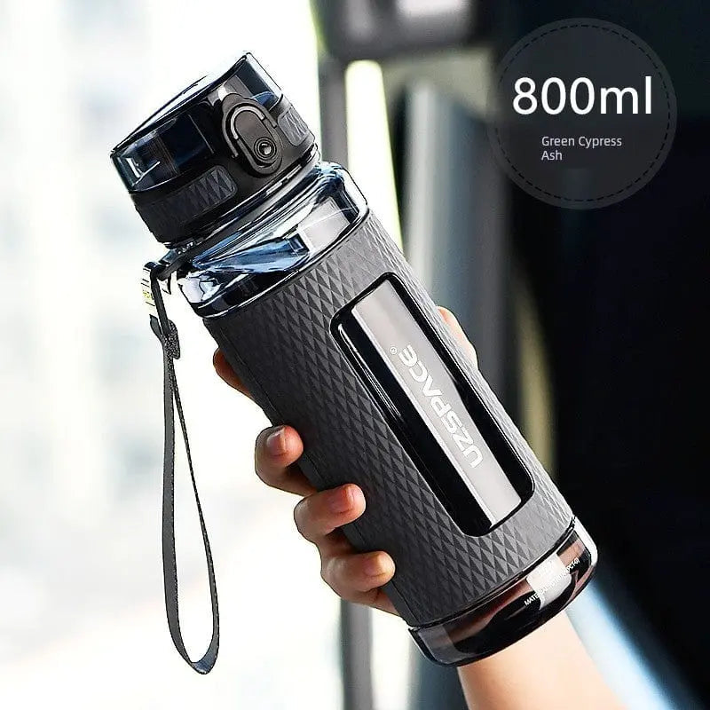 Large capacity Uzspace Tritan sports water bottle, 1L leakproof plastic cup for men and women, high-temperature resistant and anti-fall design.