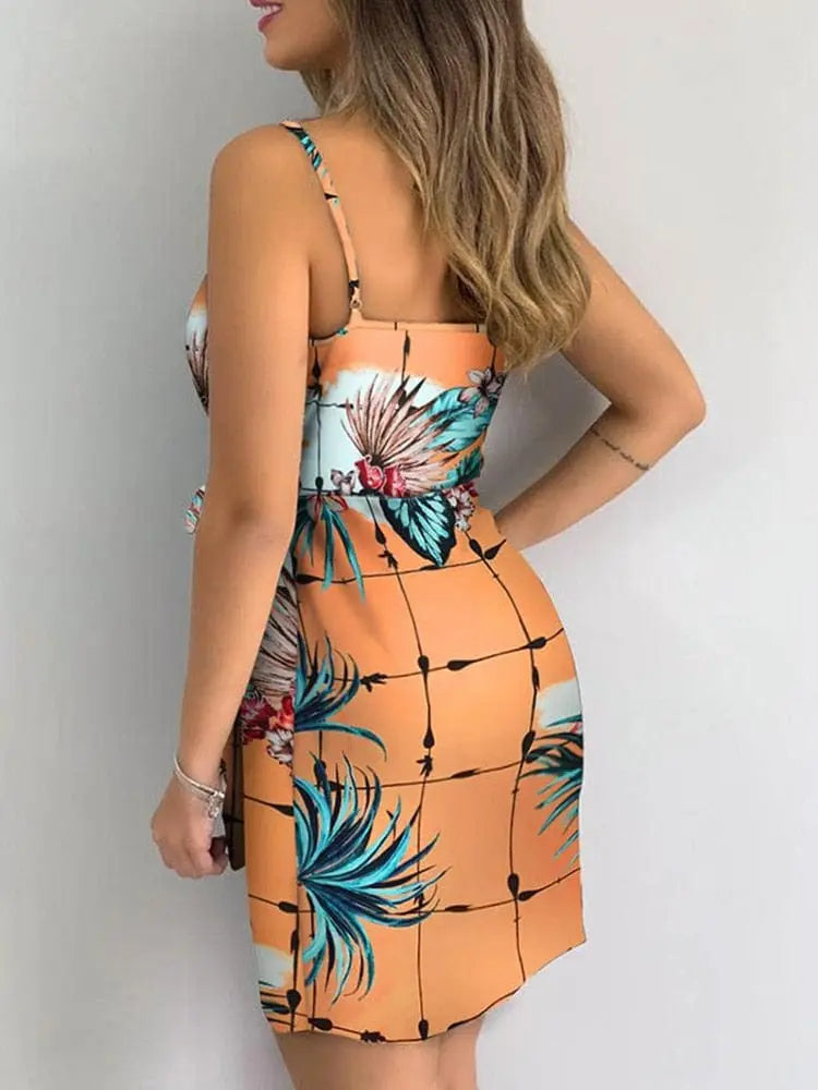 Women's tropical print V-neck wrap mini summer beach dress with sleeveless design, casual style, vibrant tropical floral pattern.