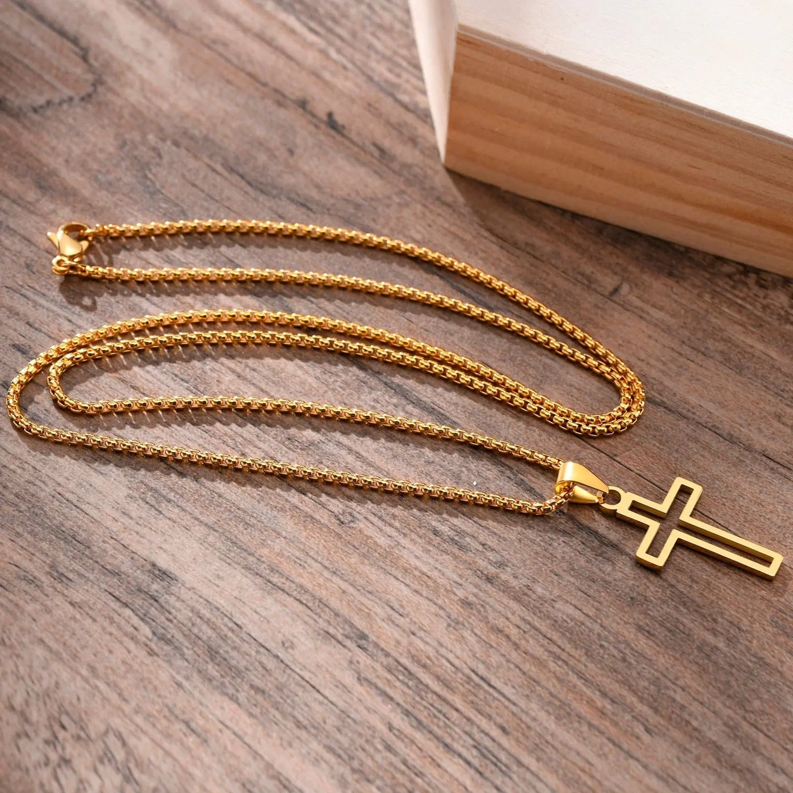 Stainless steel Vnox hollow cross necklace with cutout design and 24-inch chain, unisex religious faith jewelry.