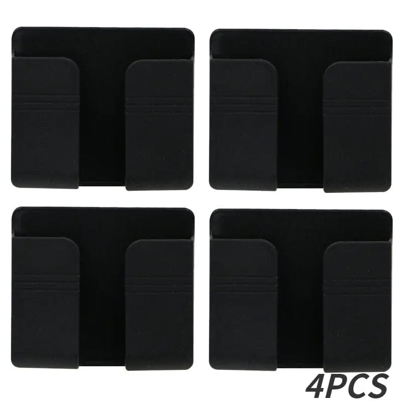 Wall-mounted Showlu mobile phone holder and charging stand, punch-free design with sleek, modern appearance for convenient device support.