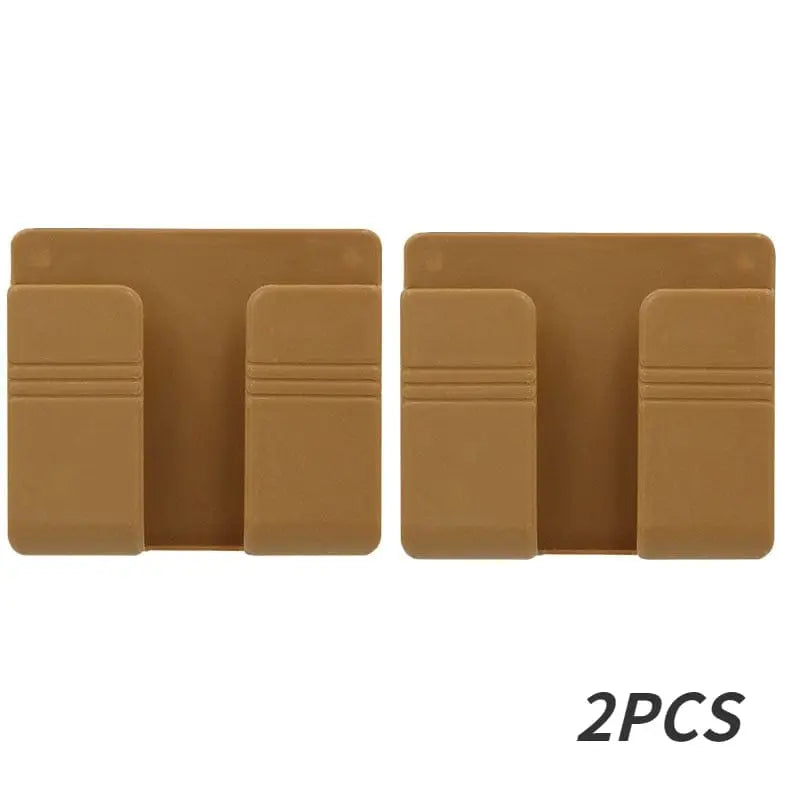 Wall-mounted Showlu mobile phone holder with punch-free charging stand, showcasing sleek design and easy access for smartphones.