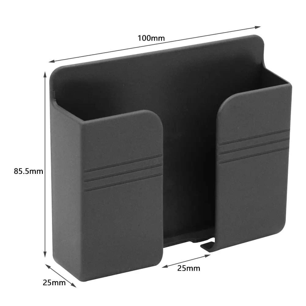 Wall-mounted Showlu Fashion Store mobile phone holder with punch-free design for easy charging and secure placement.