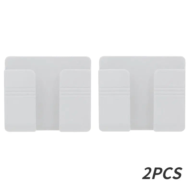 Wall-mounted Showlu mobile phone holder with punch-free design, featuring a charging stand for convenient hands-free use.