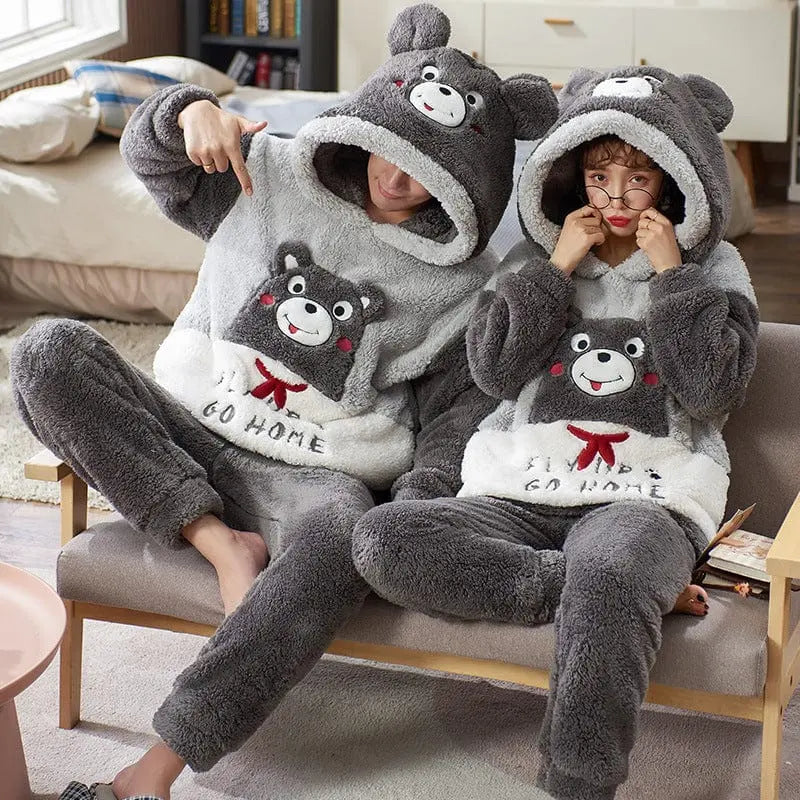 Unisex cartoon velvet flannel pajamas set for adults with playful print, soft fabric, and cozy sleepwear design.