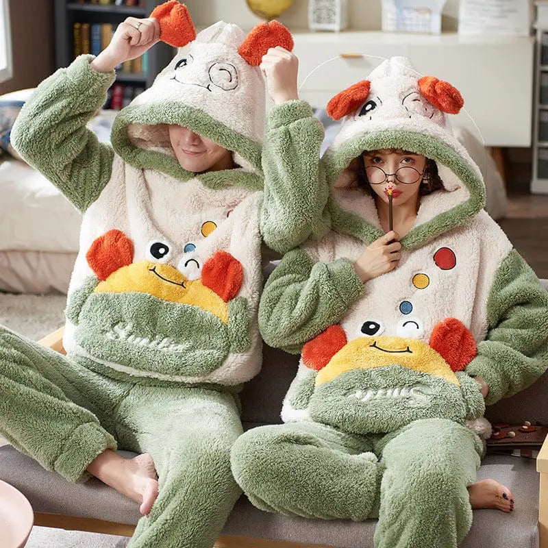 Unisex cartoon velvet flannel pajamas set for adults, featuring colorful cartoon designs, soft fabric, and comfortable sleepwear.