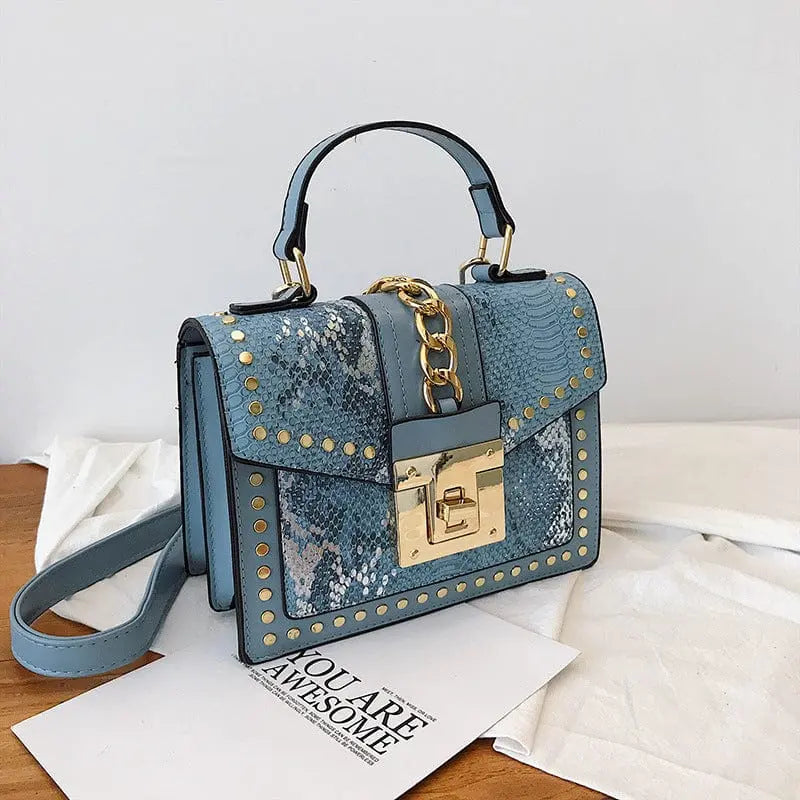 Showlu snakeskin PU leather women's handbag with designer lock, crossbody style, featuring a sleek shoulder bag design.