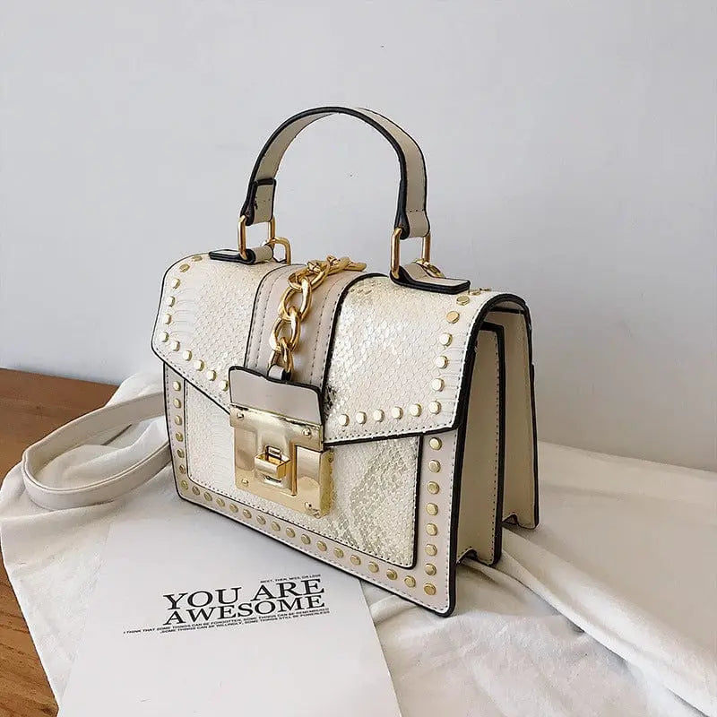 Showlu snakeskin PU leather women's handbag with designer lock, crossbody style, shoulder strap, and stylish purse design.
