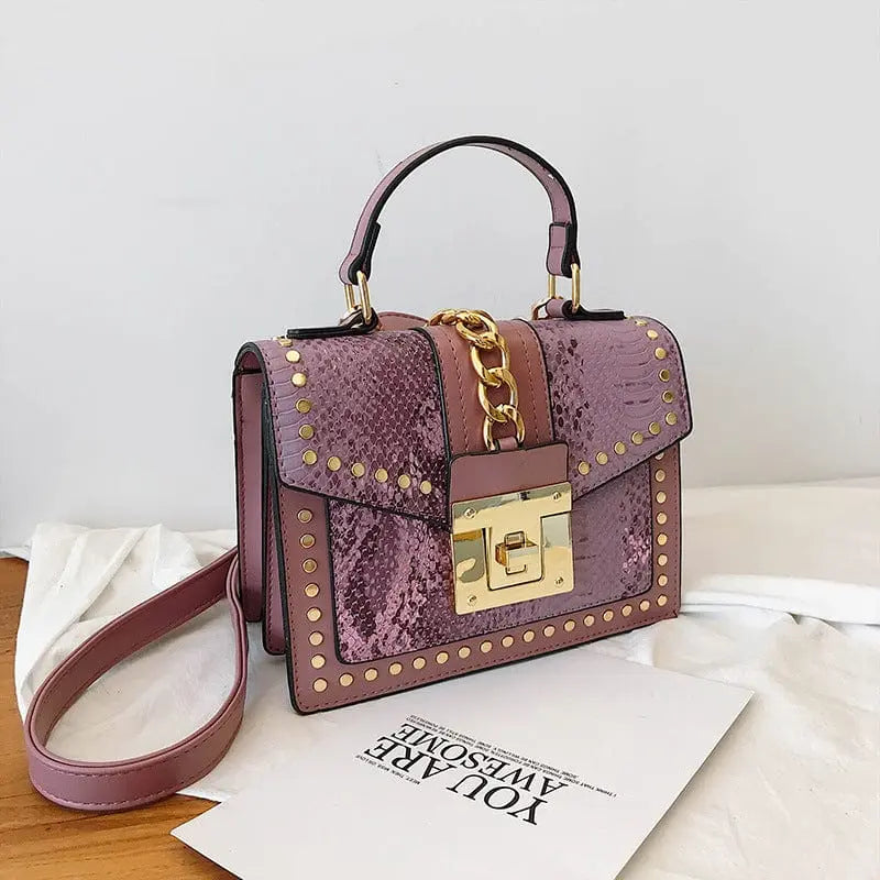 Showlu snakeskin PU leather women's crossbody handbag with designer lock, shoulder strap, and stylish snakeskin pattern.
