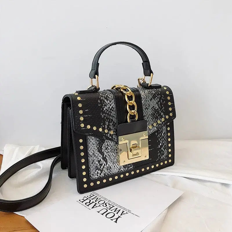 Showlu snakeskin PU leather women's handbag with designer lock, crossbody style, featuring a sleek shoulder strap and stylish design.