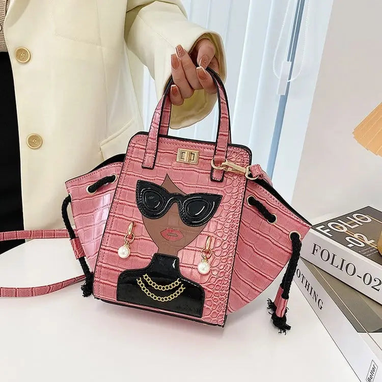 Showlu Women's black crocodile pattern foldable crossbody handbag with face design and spacious interior.