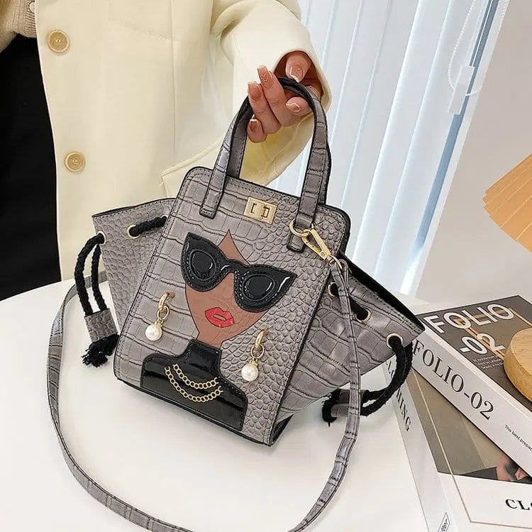 Showlu Women's crocodile pattern foldable black crossbody handbag with face design, stylish and compact for everyday use.