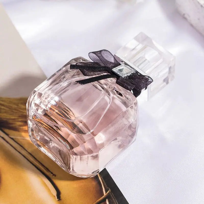 Luxury women's perfume by Showlu Fashion Store in a elegant glass bottle, showcasing a private label fragrance.