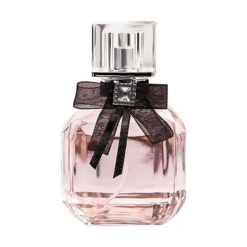 Luxury women's perfume by Showlu Fashion Store in a clear glass bottle, showcasing elegant fragrance for women.