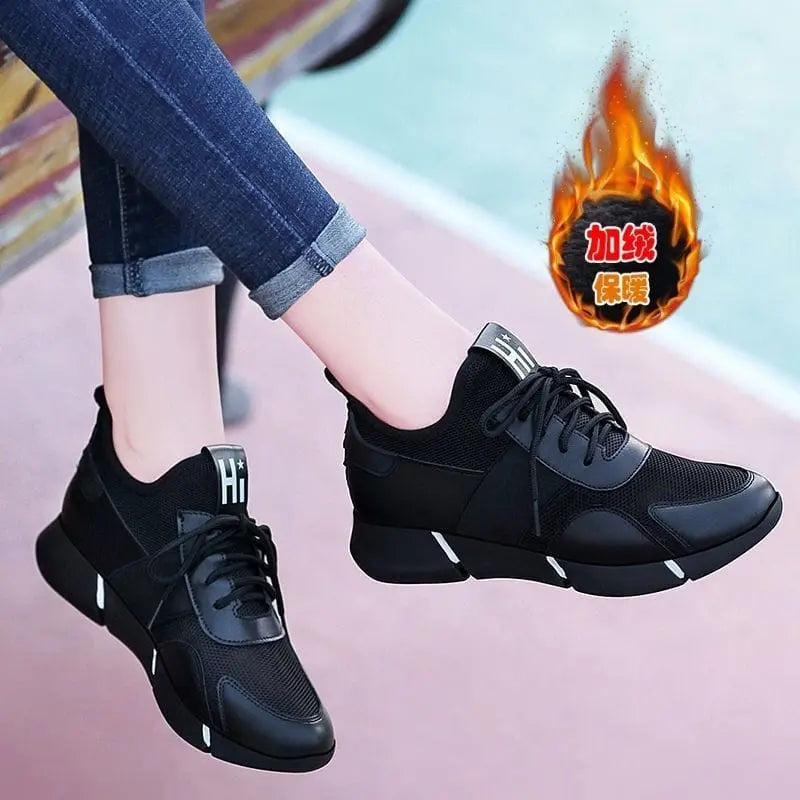 Showlu Women's black casual sport sneakers with breathable mesh uppers, designed for comfort and everyday athletic wear.